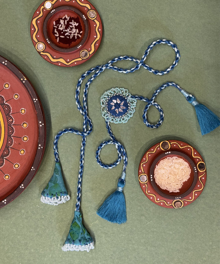 Shades of blue bead work beads mirror fabric anchor threads rakhi