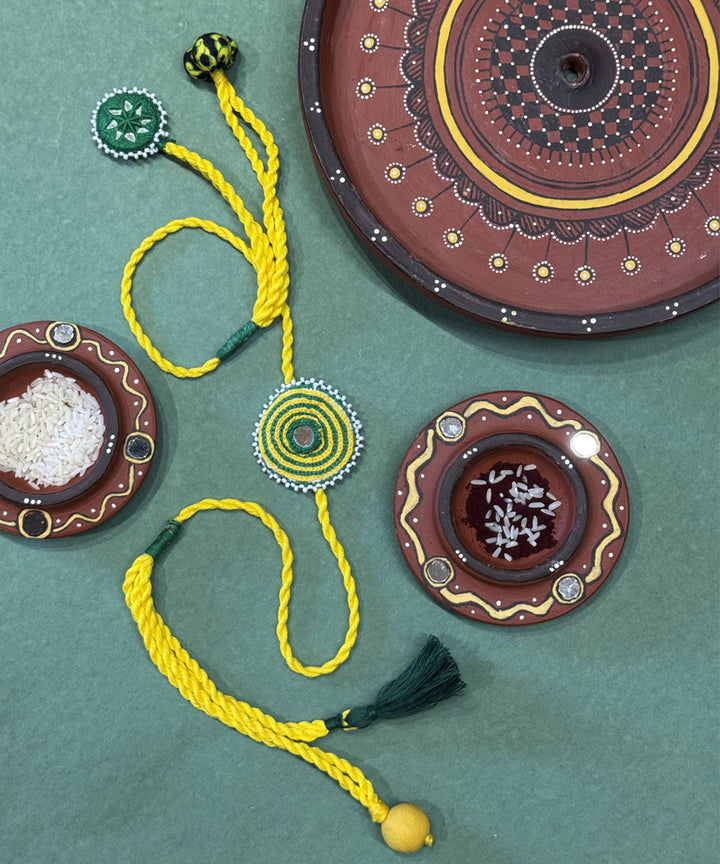 Yellow green handmade mirror fabric beads anchor threads rakhi