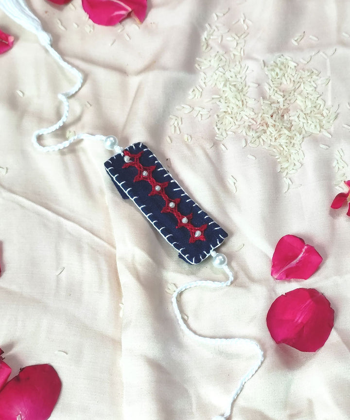 Blue white thread work upcycled fabric handcrafted rakhi