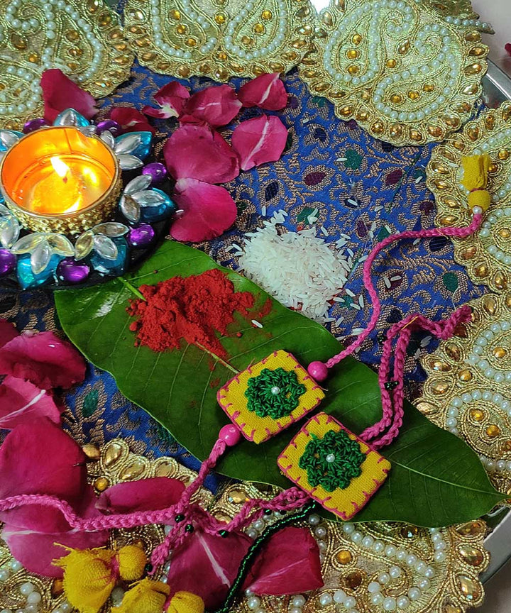 Yellow green thread work upcycled fabric handcrafted rakhi