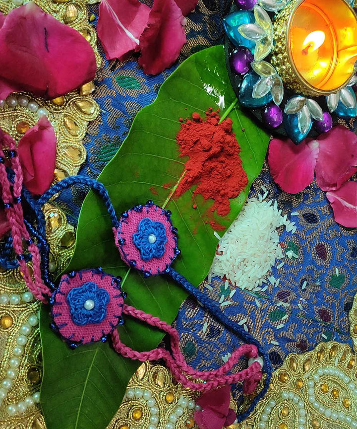 Blue pink hand crafted thread work upcycled fabric rakhi