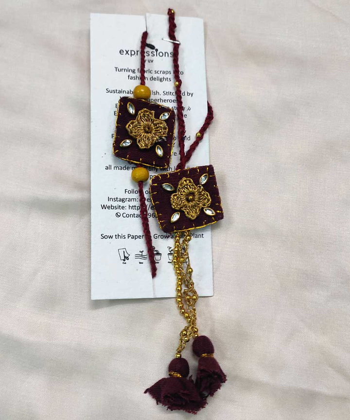 Maroon yellow hand crafted thread work upcycled fabric rakhi