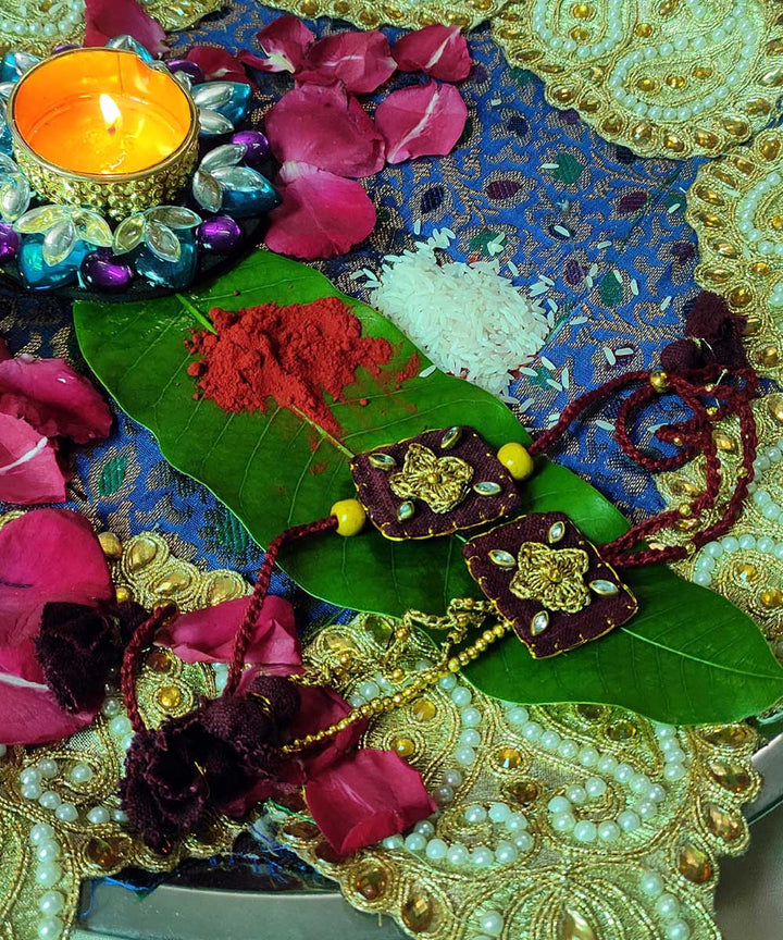 Maroon yellow hand made thread work upcycled fabric rakhi