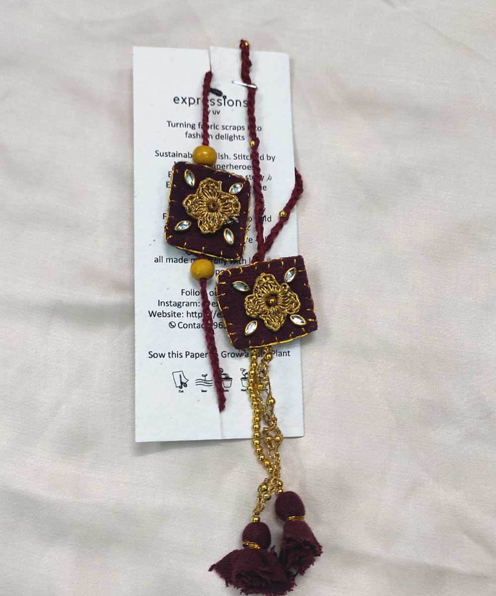 Maroon yellow hand made thread work upcycled fabric rakhi