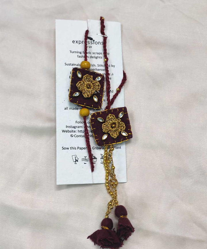 Maroon yellow hand made thread work upcycled fabric rakhi