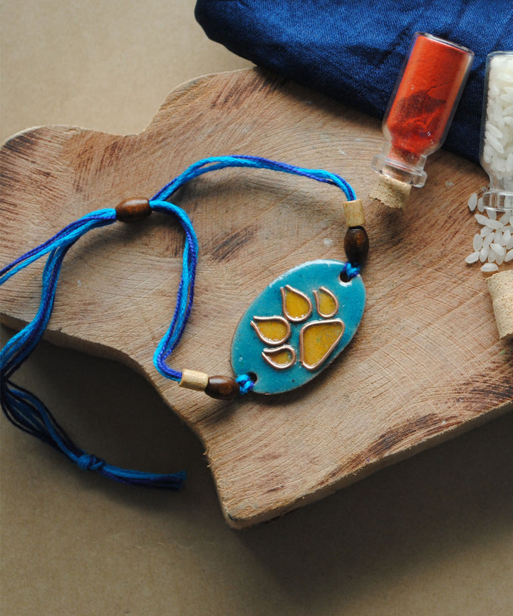 Blue yellow hand crafted copper enamelling rakhi