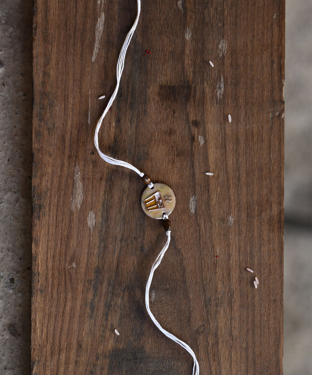 Brown handmade enamelling copper rakhi