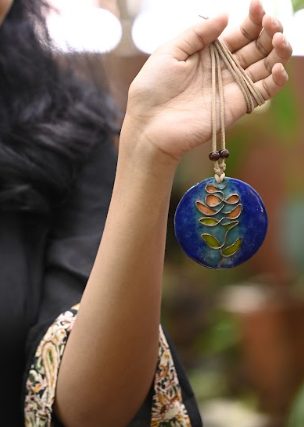 Blue tree pendant with hand woven cotton string