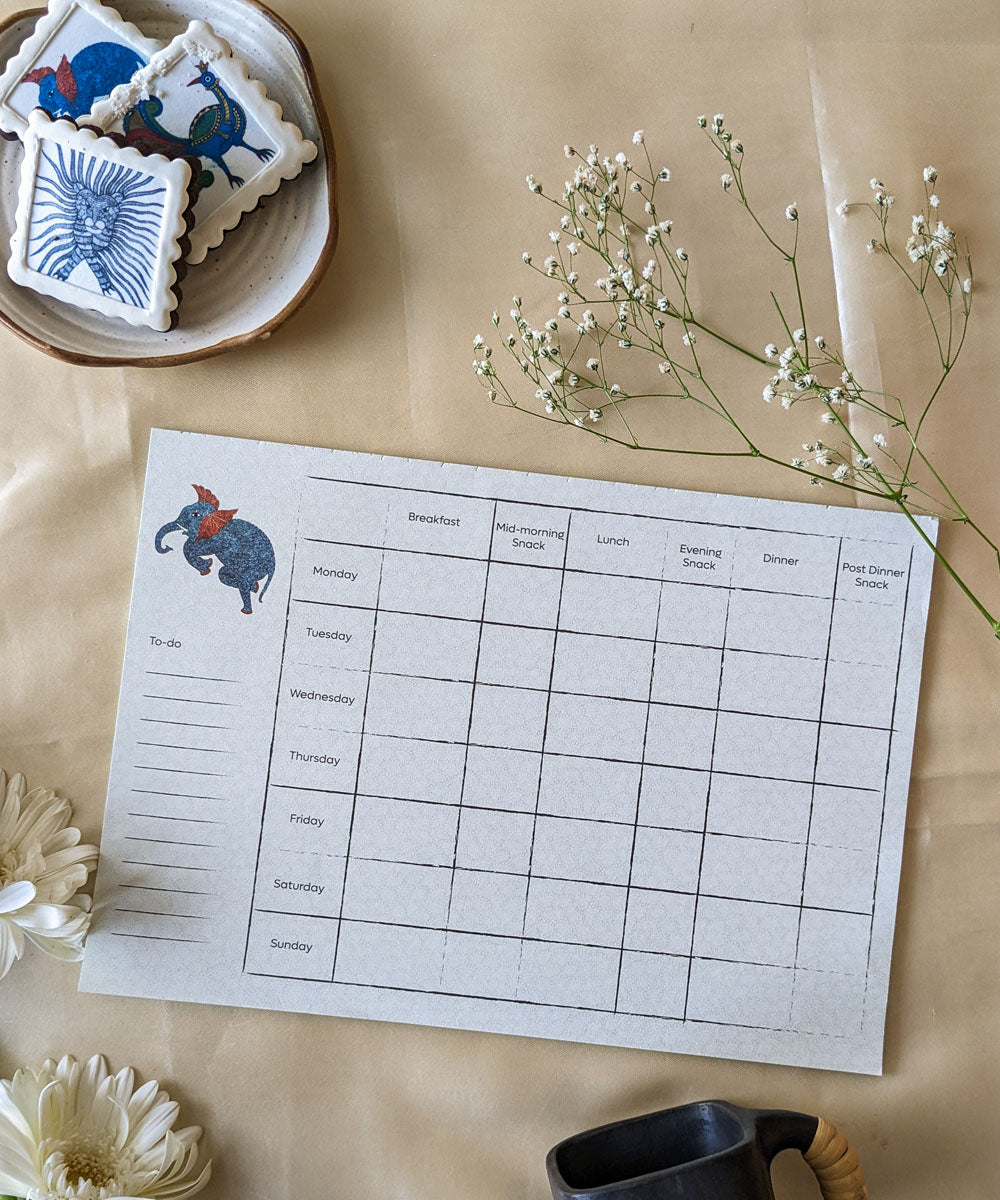 Green handcrafted gond art kitchen menu planner