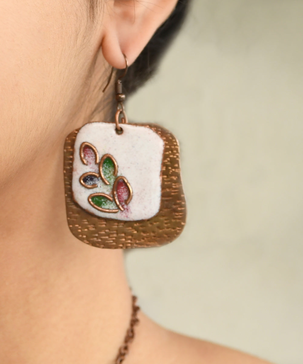 White golden handcrafted leaf motif copper enamel earrings