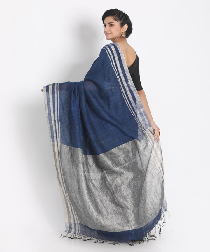 Blue linen saree with silver zori border