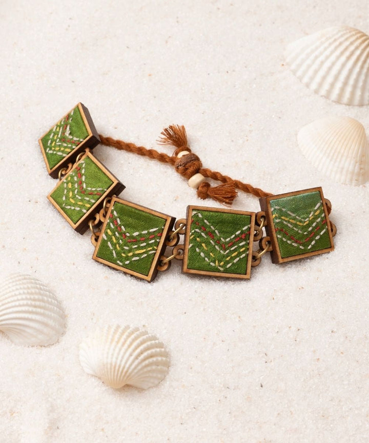 Green hand embroidered repurposed silk fabric and wood bracelet