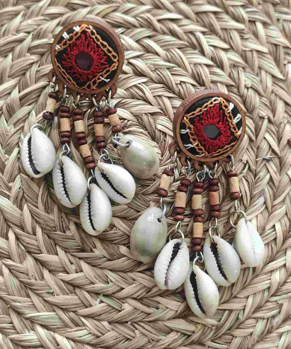 Red hand embroidered earrings with cowry