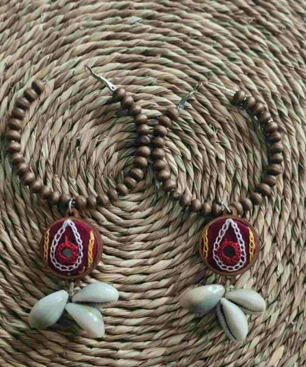 Multicolor hand embroidered hoop earrings with wooden beads