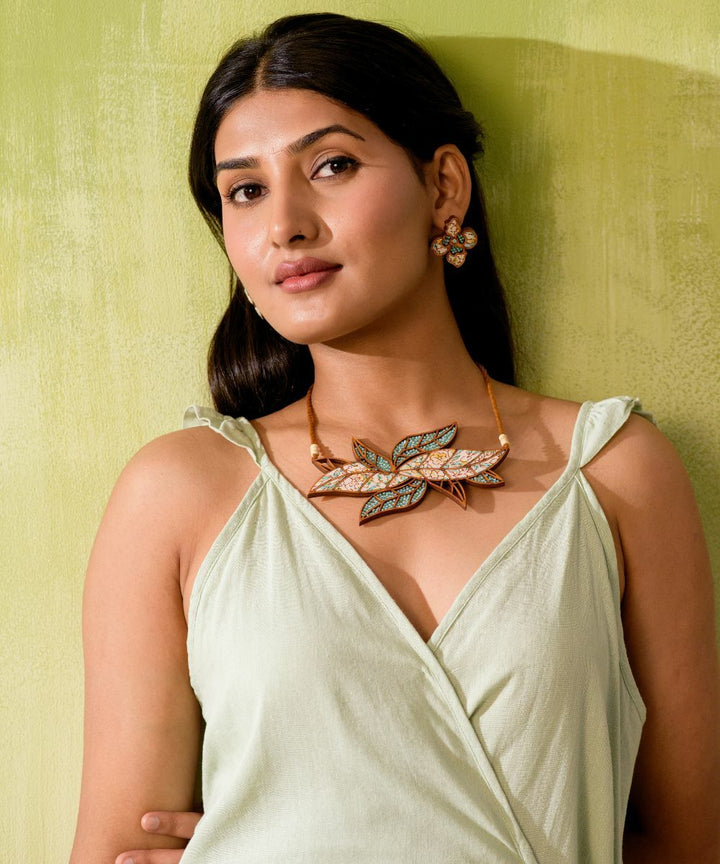 Turquoise white handmade bloom leaf motif repurposed wood necklace