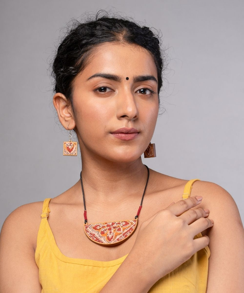 Red repurposed kalamkari fabric and repurposed wood pendant