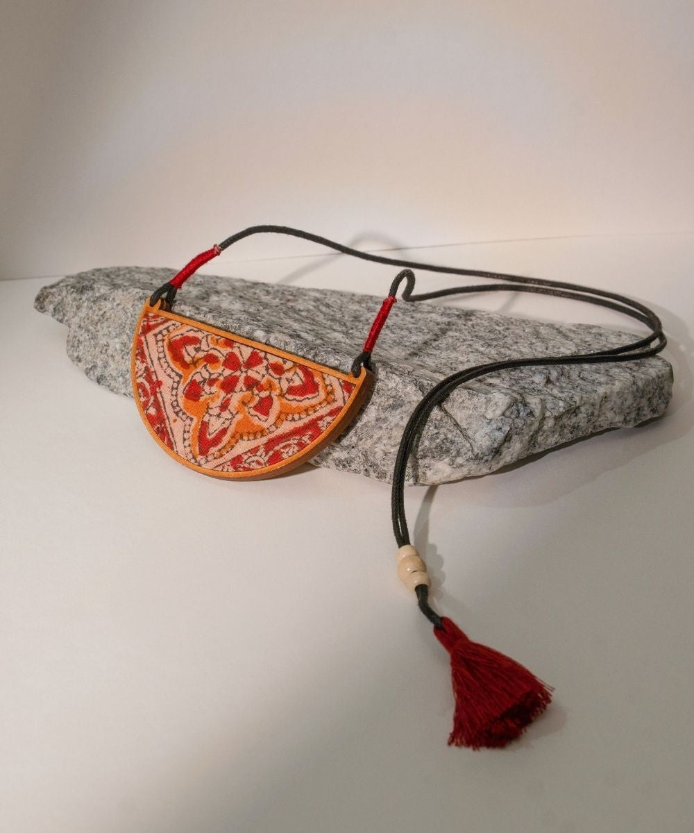 Red repurposed kalamkari fabric and repurposed wood pendant