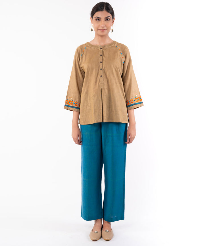Beige hand embroidered cotton flared top
