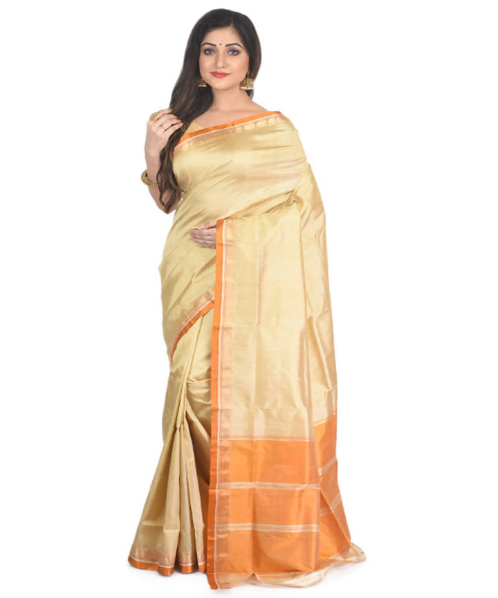 Cream and orange handloom garad silk saree