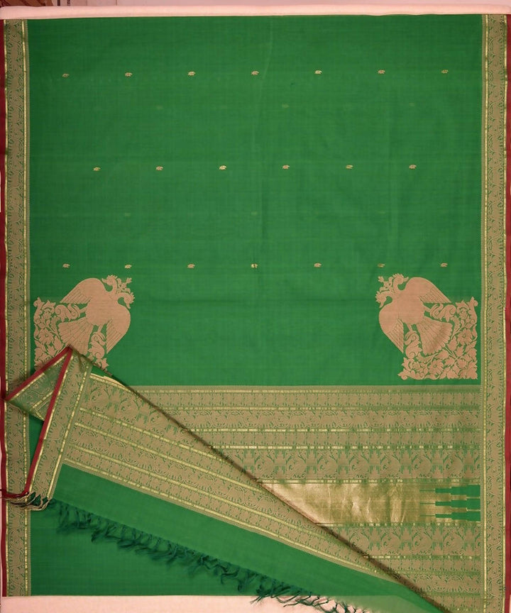 Dark green handloom kanchi cotton saree with gandaberunda corner motif