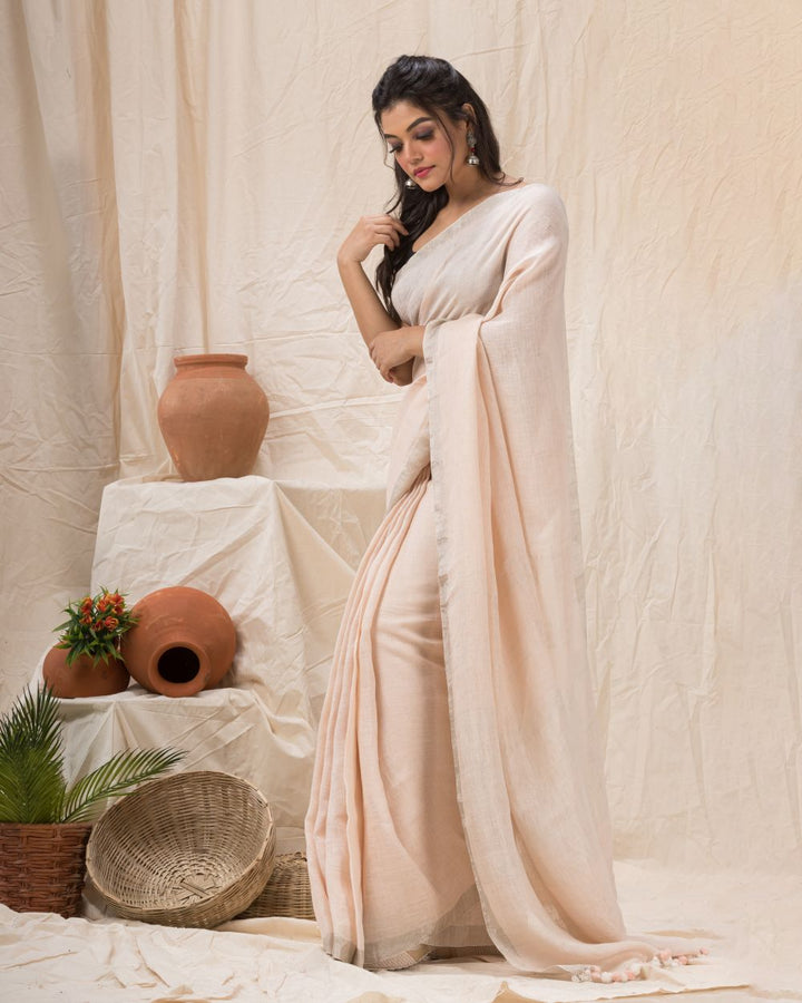 Faded pink handwoven linen bengal saree
