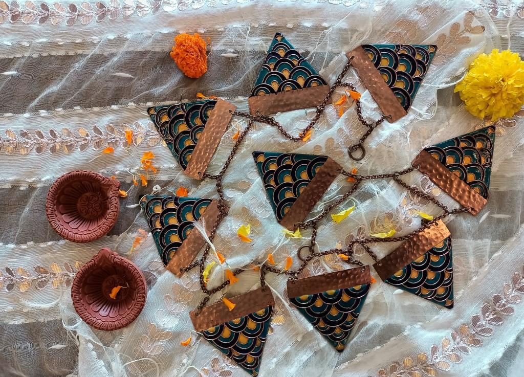 Handcrafted enamel toran and terracotta diya set