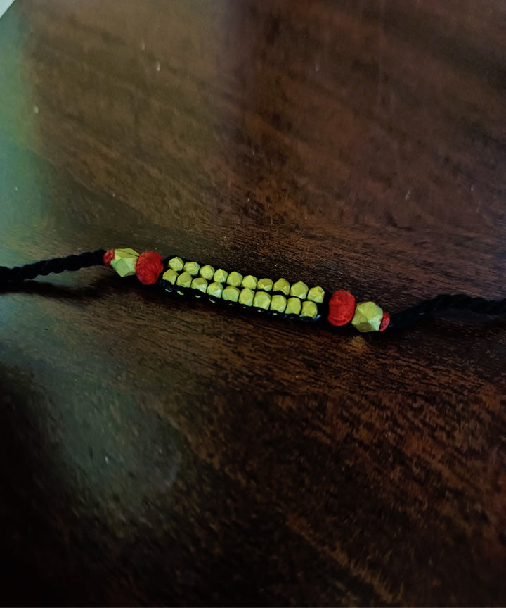 Set of four handcrafted dhokra brass rakhi with cotton thread