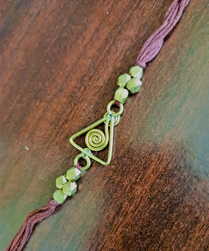 Set of four handcrafted dhokra brass rakhi with cotton thread