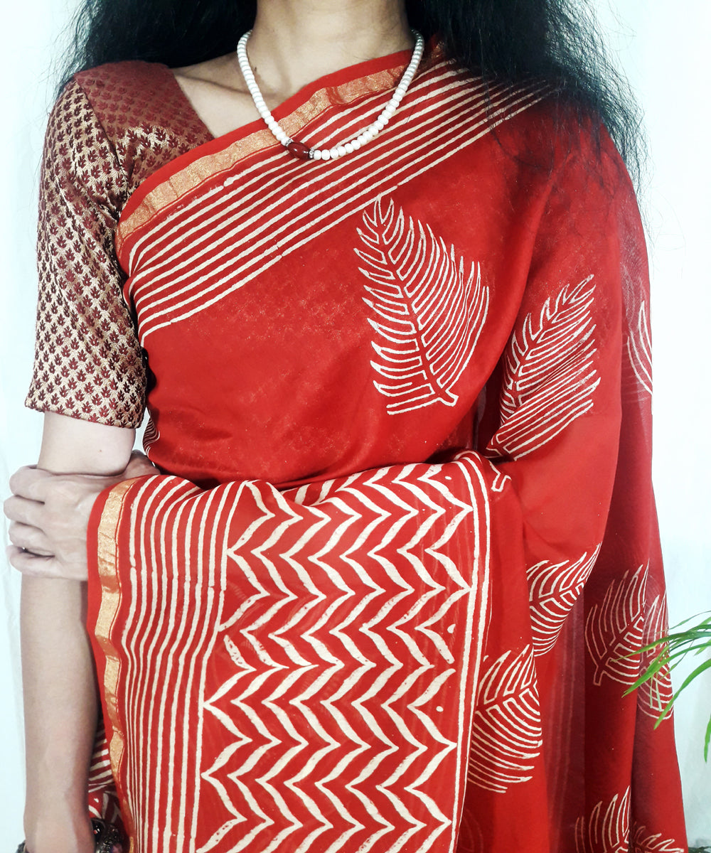 Bright orange hand printed silk ajrakh saree