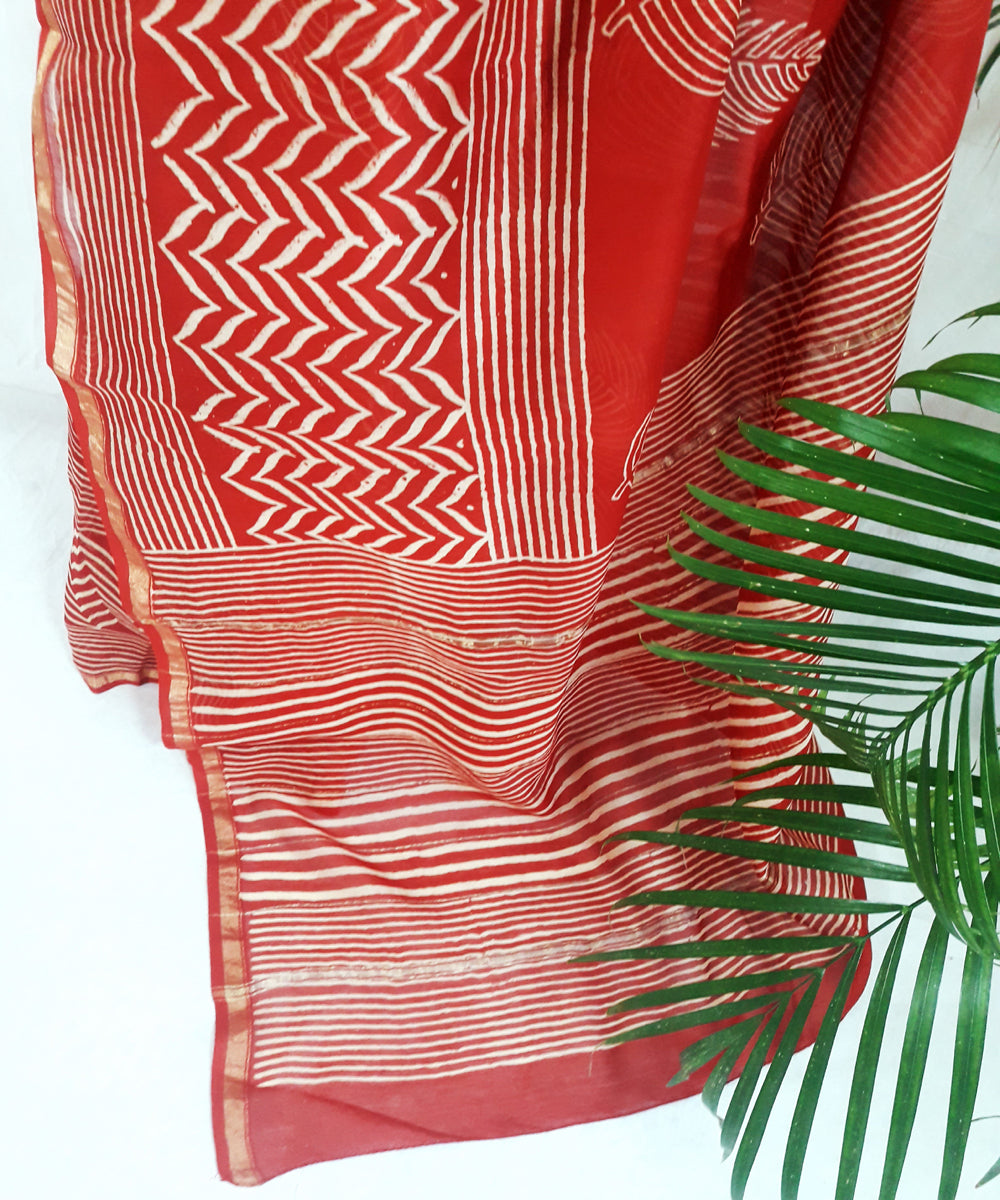 Bright orange hand printed silk ajrakh saree