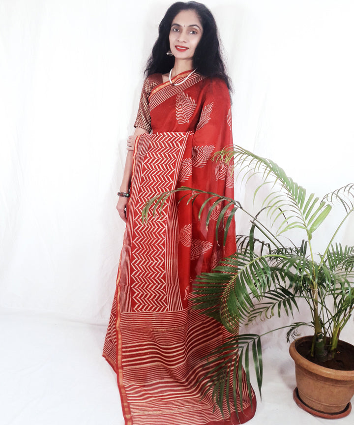 Bright orange hand printed silk ajrakh saree