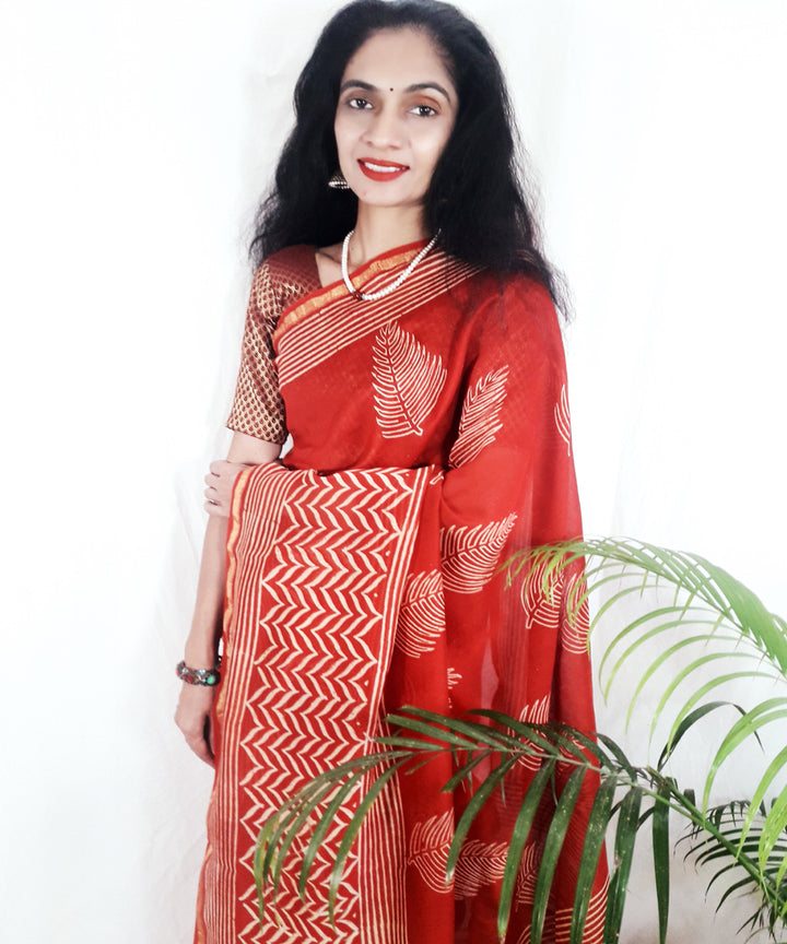 Bright orange hand printed silk ajrakh saree