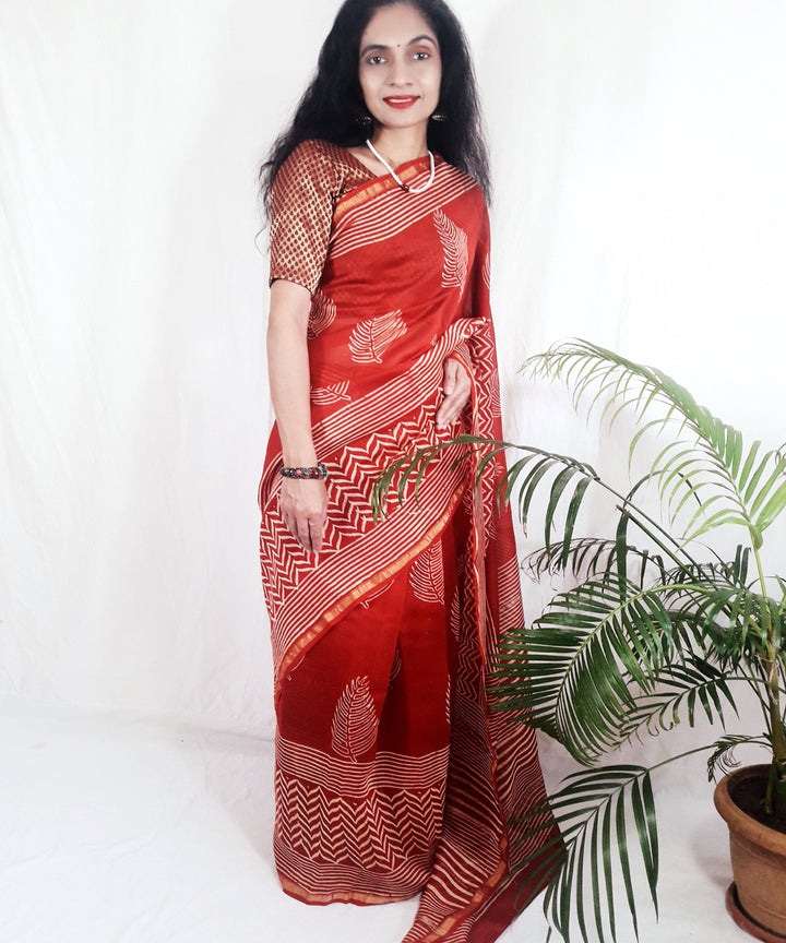 Bright orange hand printed silk ajrakh saree