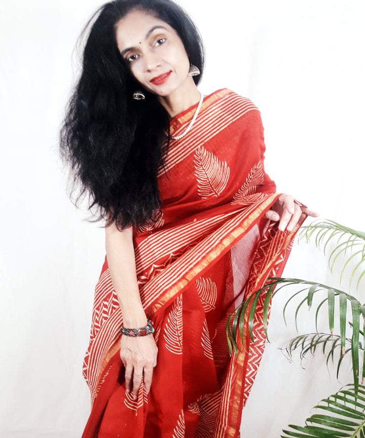 Bright orange hand printed silk ajrakh saree