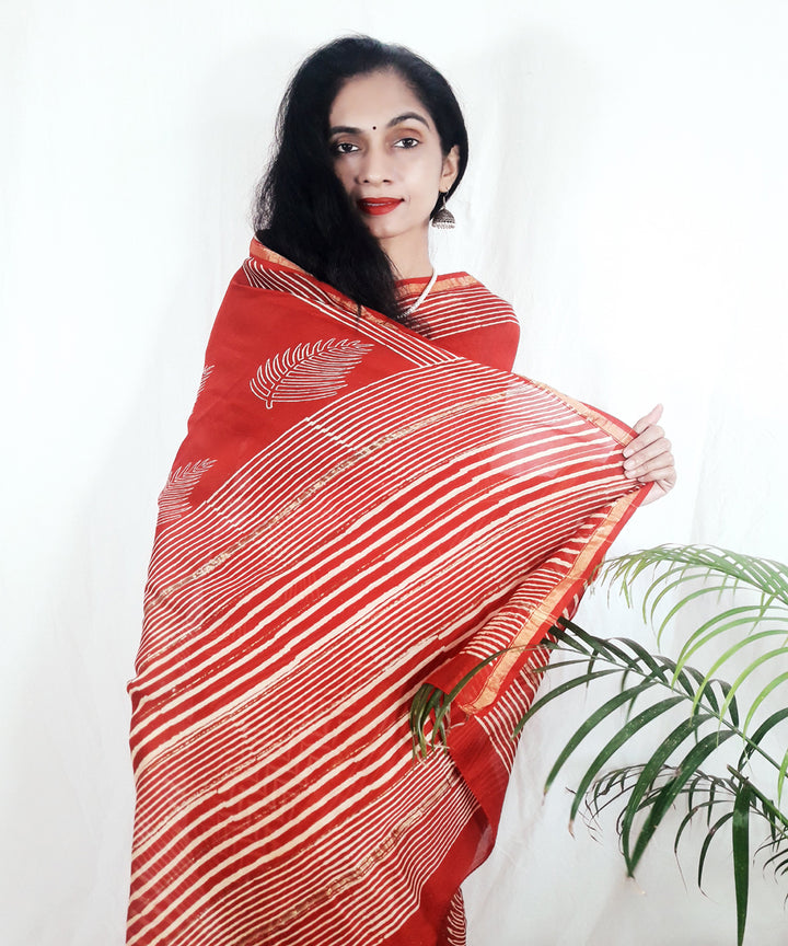 Bright orange hand printed silk ajrakh saree