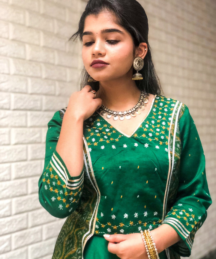 Green chanderi and silk ikat handwoven lehenga with hand embroidery