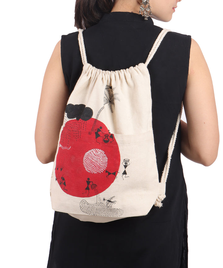 Beige red cotton hand painted warli sack bag