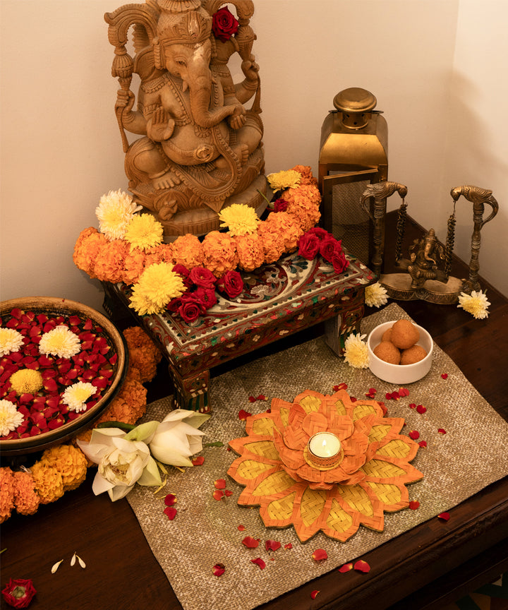 Yellow handcrafted bamboo rangoli with lotus tea light holder