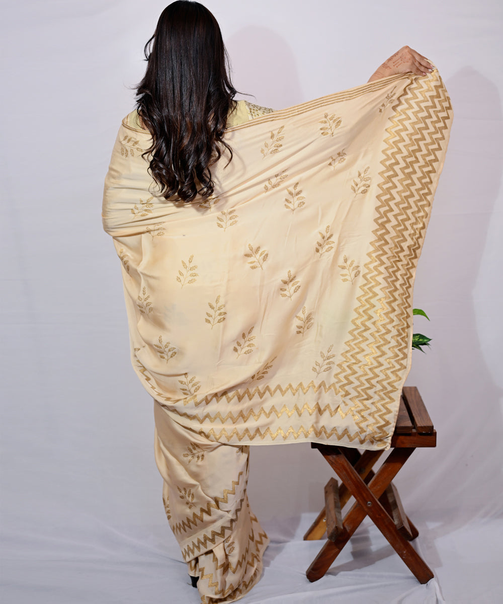 Cream golden yellow hand block printed modal silk saree