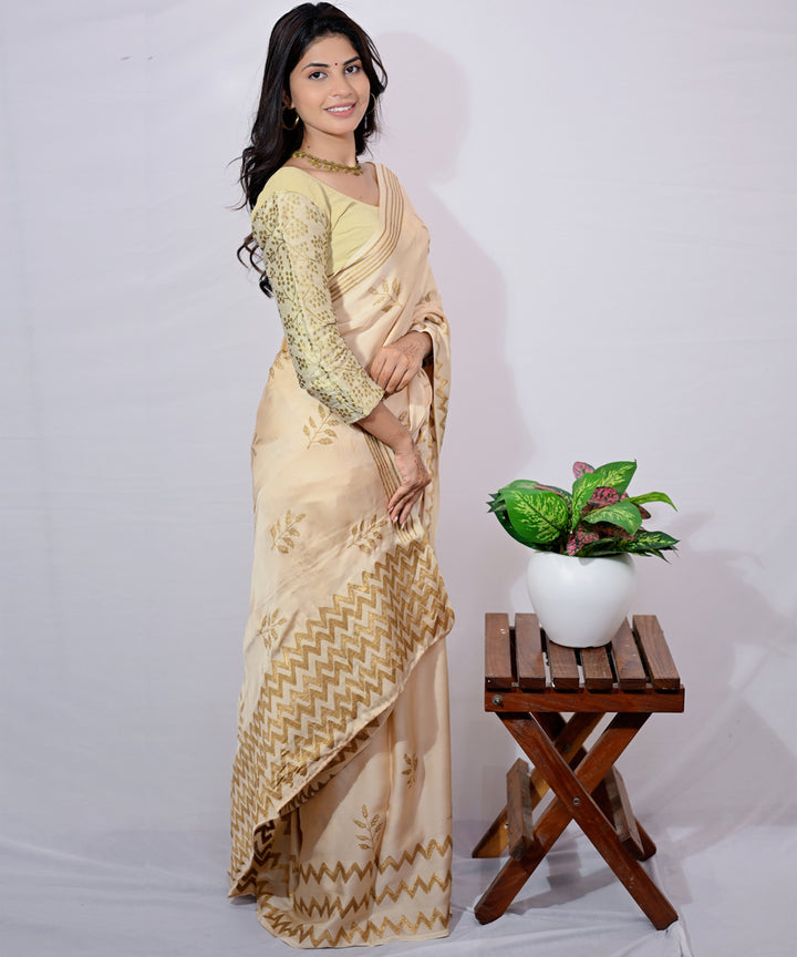 Cream golden yellow hand block printed modal silk saree