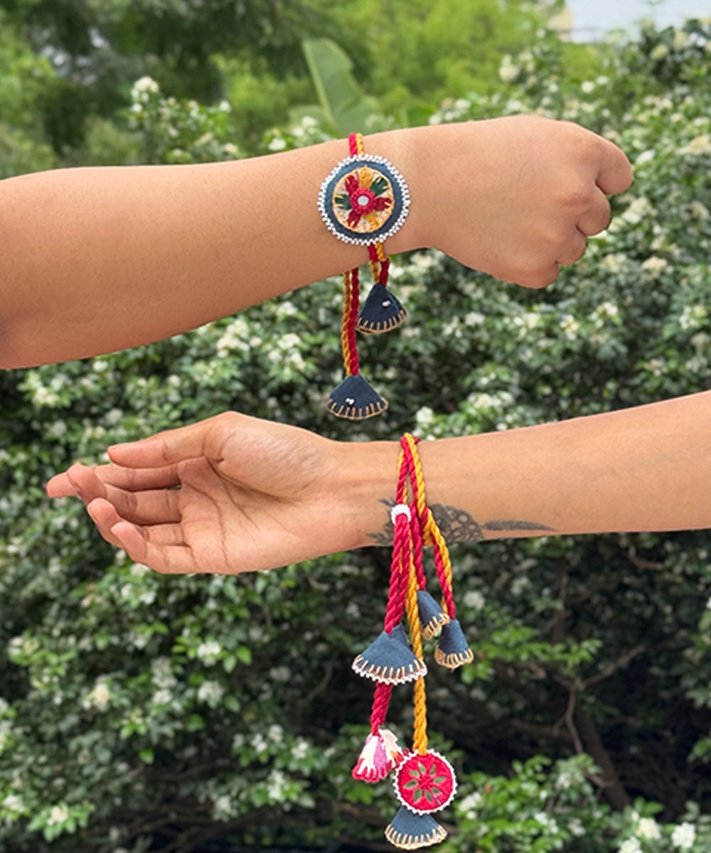 Red yellow blue handmade beads fabric mirror anchor threads rakhi