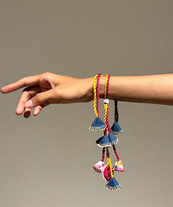 Red yellow blue handmade beads fabric mirror anchor threads rakhi