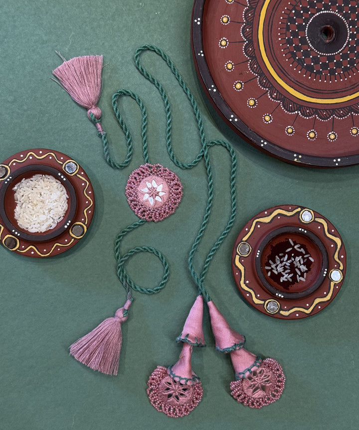 Pink sea green bead work beads mirror fabric anchor threads rakhi