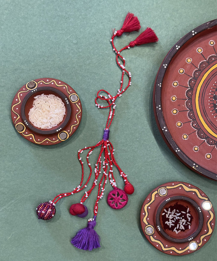 Pink purple mirror fabric terracota bead beads anchor threads rakhi