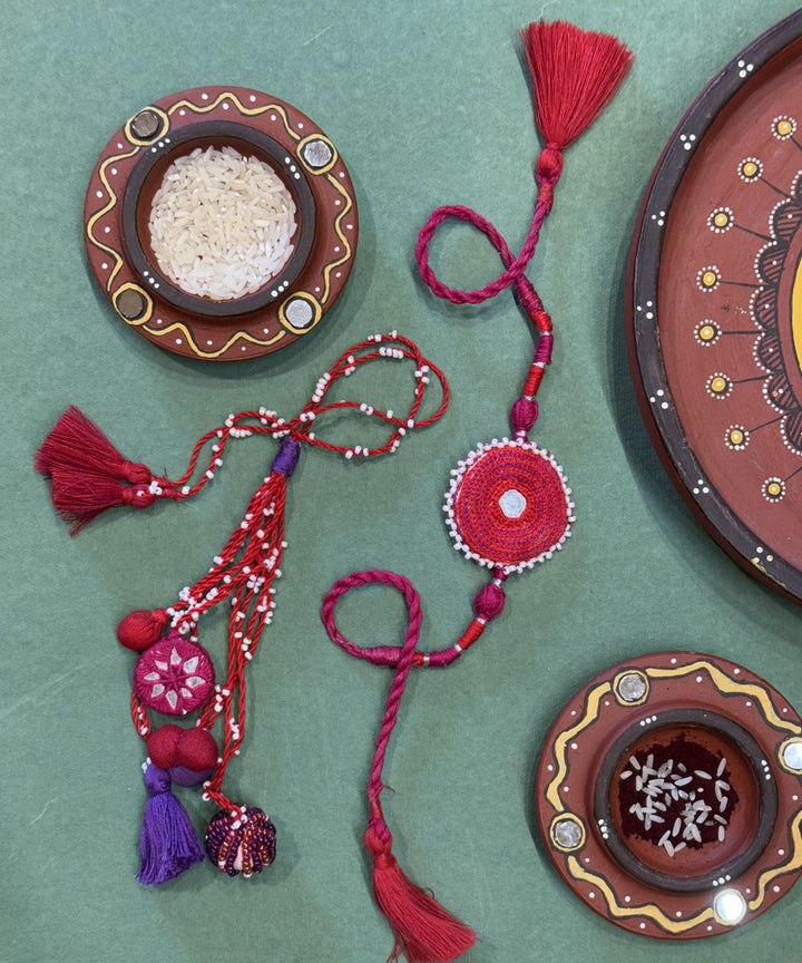 Handmade bead work mirror fabric terracota bead anchor threads rakhi