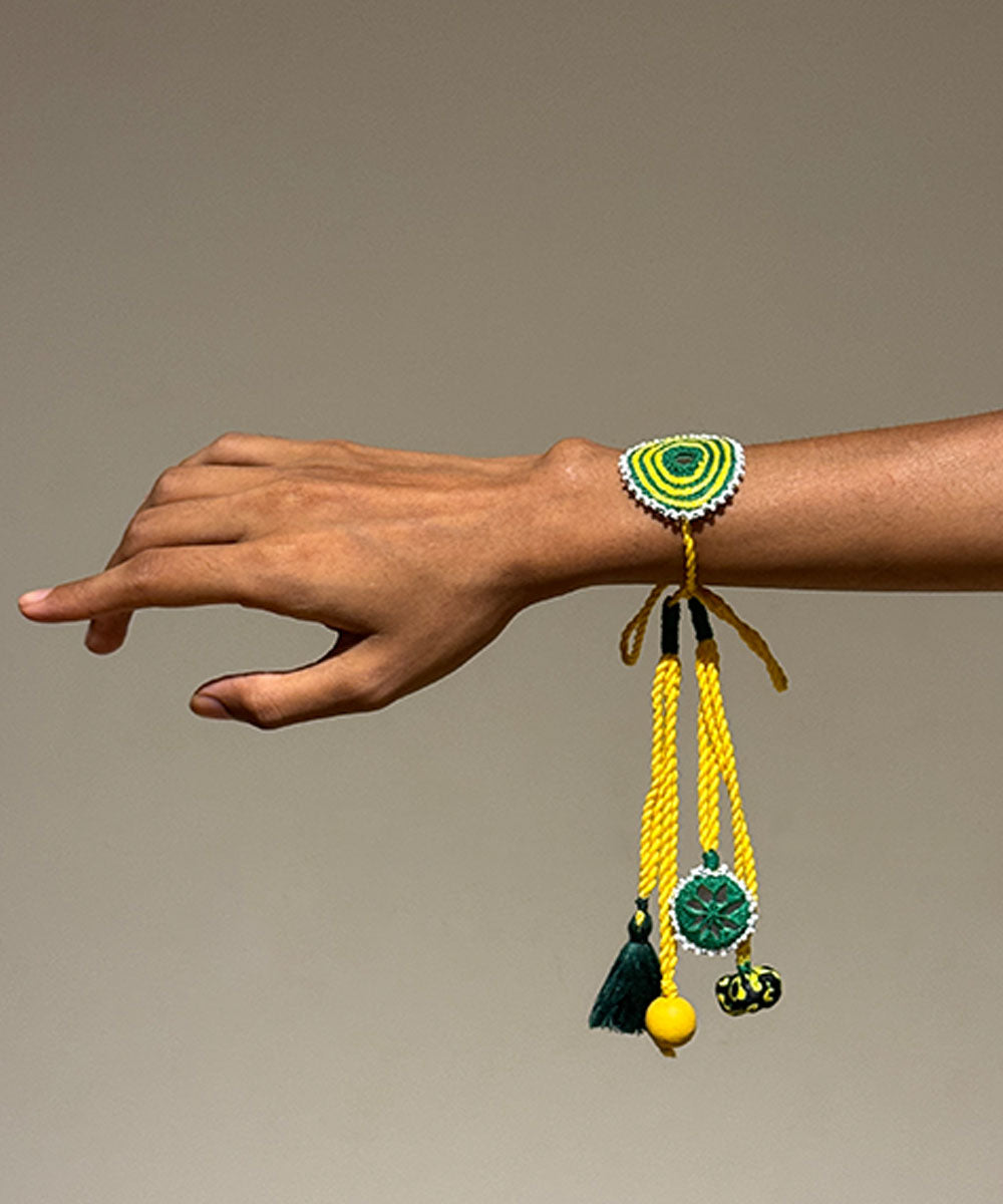 Handmade yellow green mirror fabric beads anchor threads rakhi