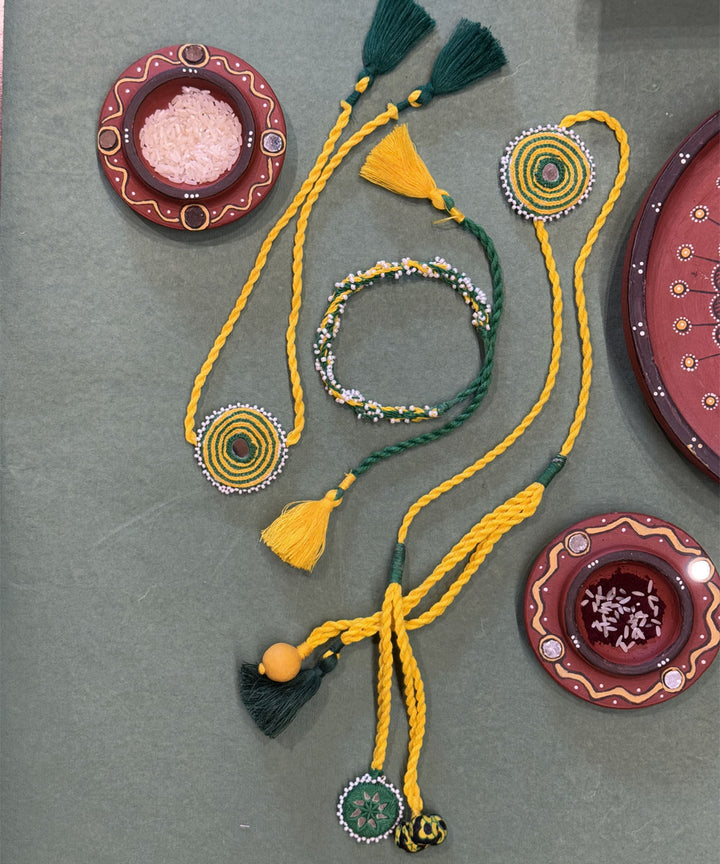 Handmade yellow green mirror fabric beads anchor threads rakhi