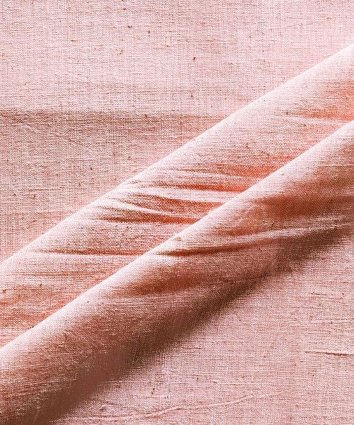 Peach yarn dyed kala cotton handwoven fabric
