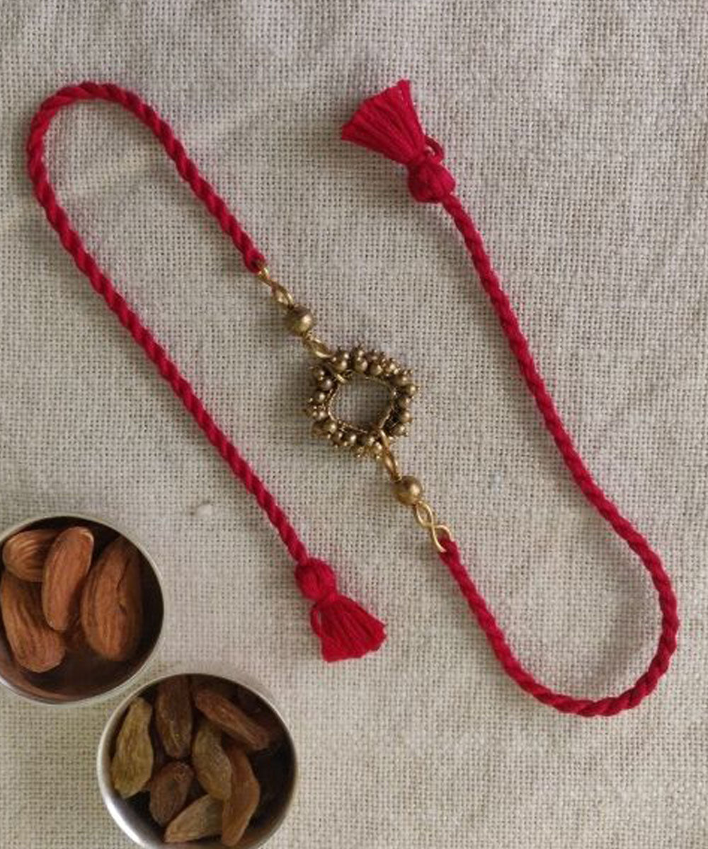Red hand made thread rakhi