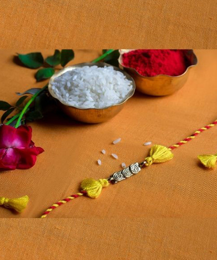Yellow red hand made thread rakhi